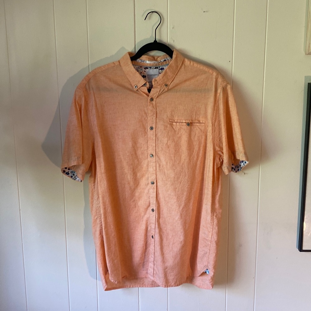 Light orange Denim and Flower button up with a colorful flower print interior